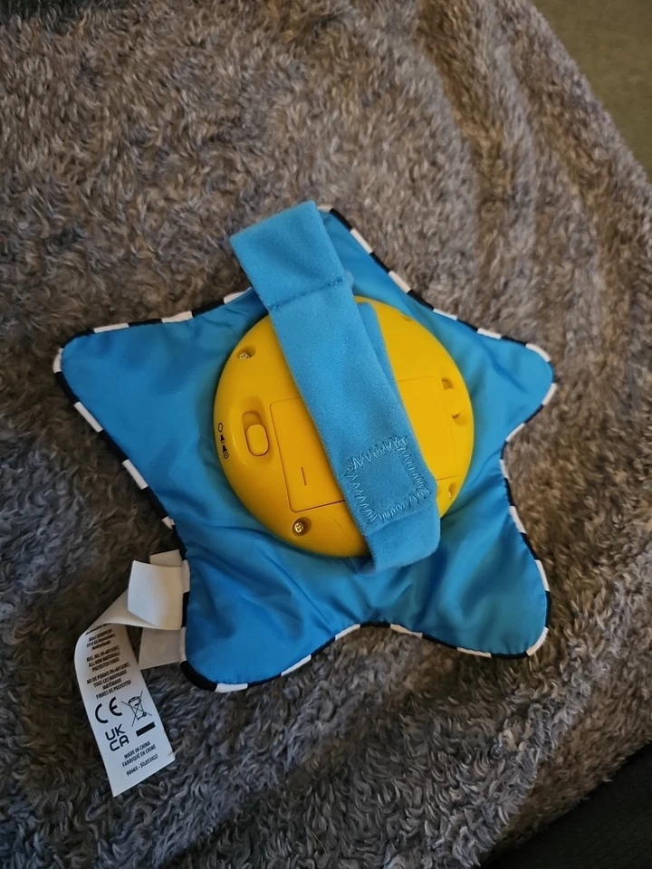 Juguete musical de peluche Baby Einstein Star Bright Symphony para llevar Foto 2 de 2