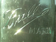 1 qt. high embossed word Mason on a script Ball Mason shoulder seal canning jar