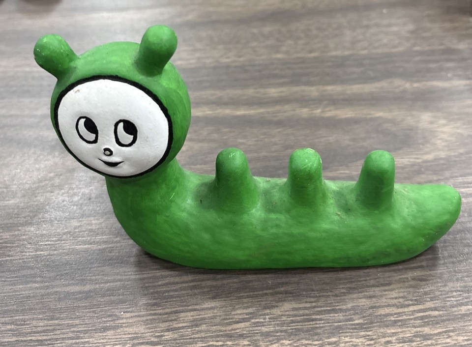 A mid-century ceramic caterpillar ring/paintbrush holder with full anthropomorphic personality — a genuinely rare, functional MCM oddity you won't find twice.