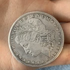 1884-CC MORGAN SILVER DOLLAR. UNCIRCULATED. HIGH GRADE.