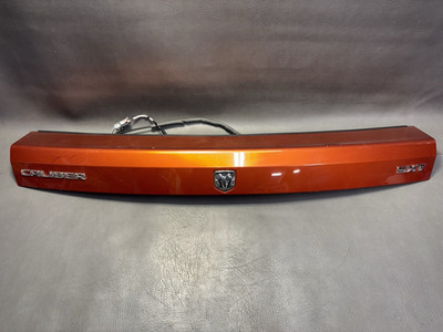 07-12 DODGE CALIBER TRUNK TRIM MOULDING TRUNK TRIM BEZEL SUNBURST ORANGE OEM
