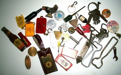 Junk drawer finds of advertising premiums key chains & tools, dog tags, odd Keys