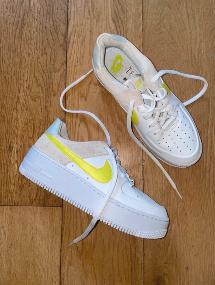 white nike air force with yellow tick