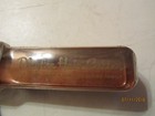 Vintage copper Playtex Hair Cutter bottle with gold lettering and “The Home Barber for the Modern Family” text.