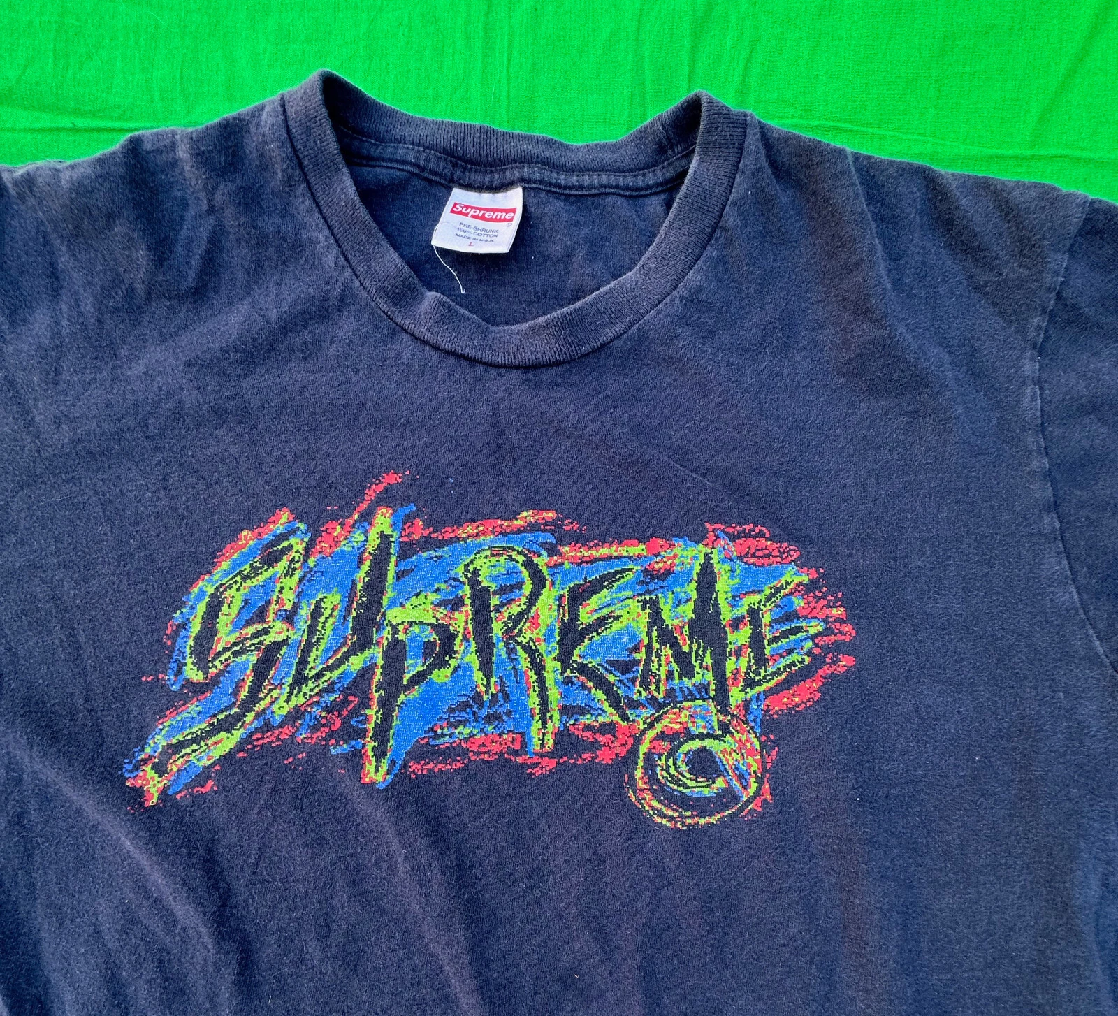 T shirt homme Supreme rayé taille L.