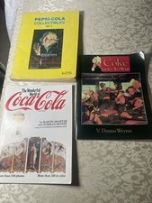(3) livres au total.  Deux livres Coca Cola et un livre Pepsi cola.