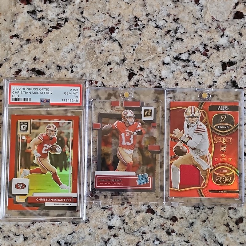 Panini 2022 NFL 49ers 3-Card Lot McCaffrey #153 PSA 77348348 Purdy RC