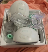 Elvie Double Breast Pump Open Box comes with 3 extra containers.