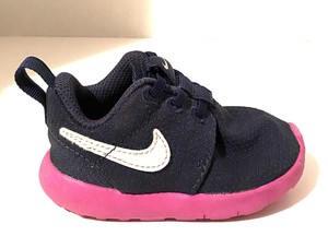 navy blue and pink nike shoes