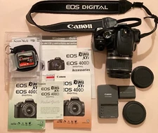 Canon EOS Rebel Xti full kit: camera, strap, battery/charger/ lens caps, papers+
