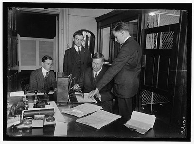 [Check signing machine in Treasury Department; operated by J.L. Summers]