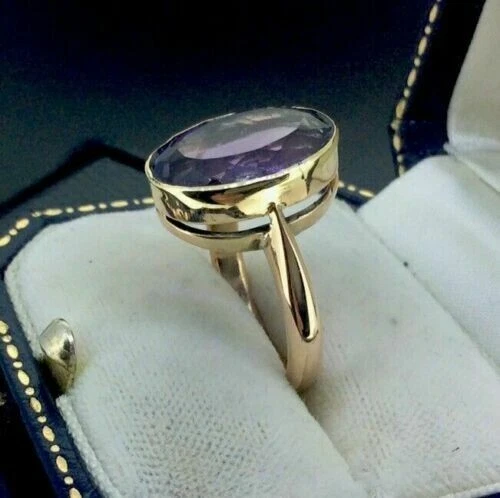 Anillo de compromiso de boda solitario de amatista de corte ovalado de 5 quilates acabado en oro amarillo de 14 quilates Foto 3 de 4