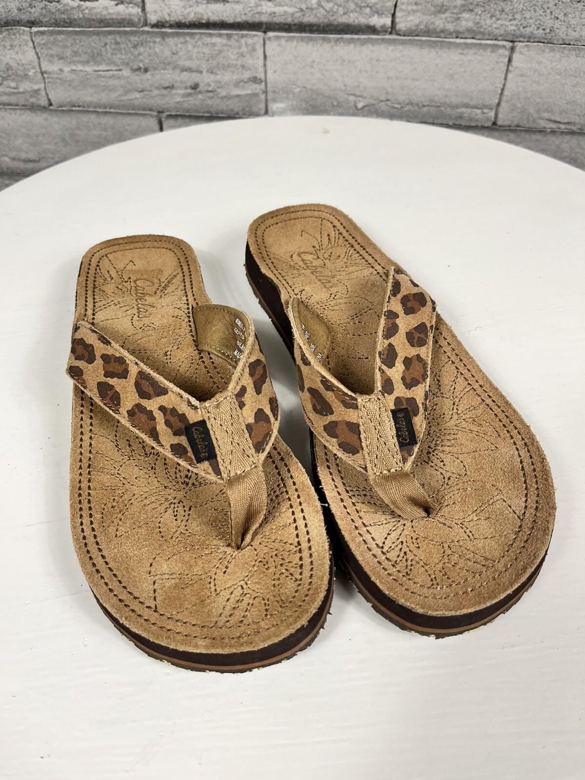 animal leather flip flops