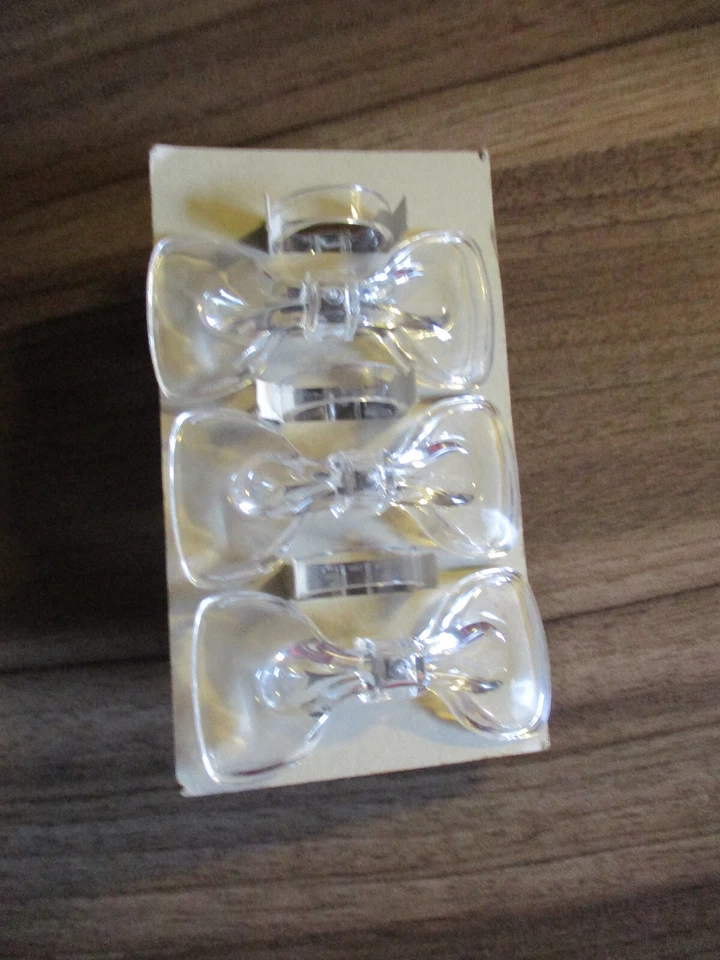 Sechs Serviertenringe aus Plastik, Motiv Schleife