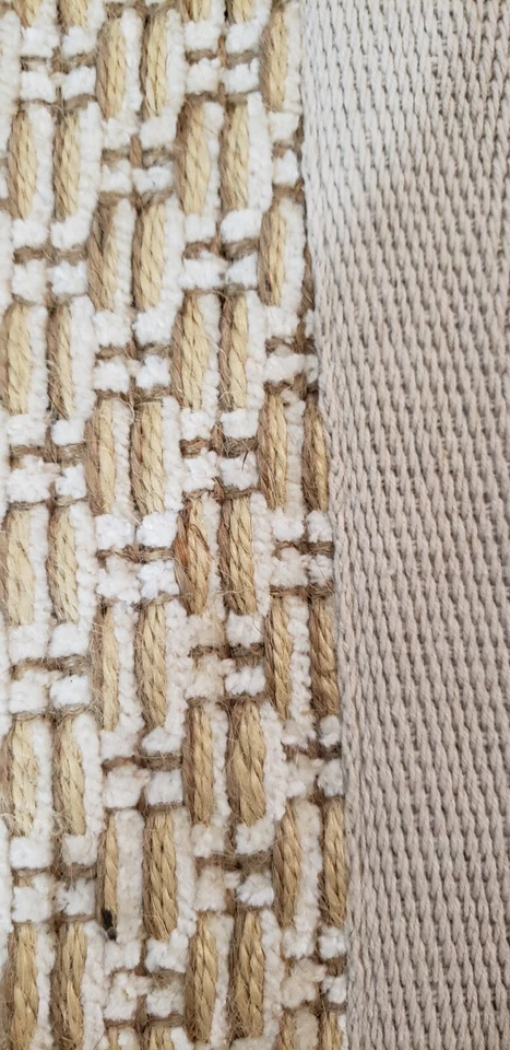 Alfombra de yute tejida a mano con tejido de canasta y borde Foto 3 de 4