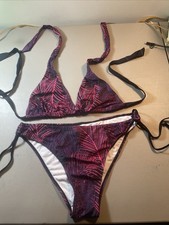 Adjustable women's two-piece bikini with a pink and purple tropical leaf print.