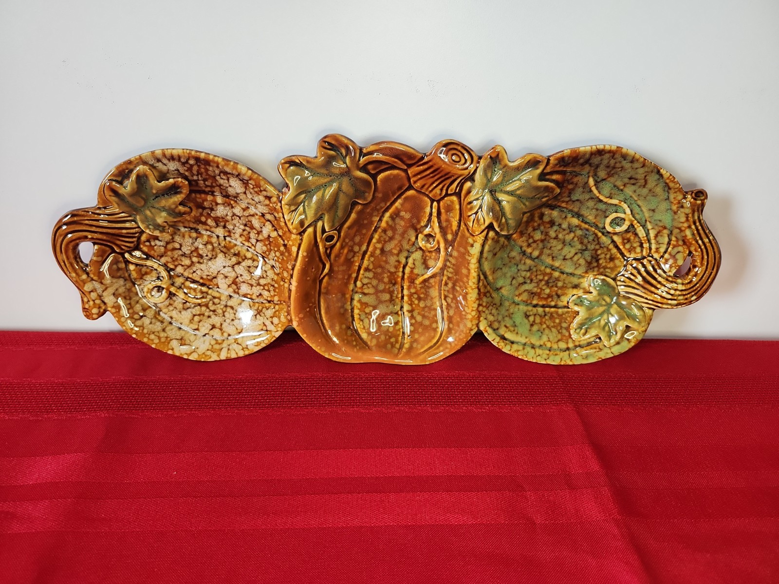 Divided three-section ceramic pumpkin relish tray for fall serving