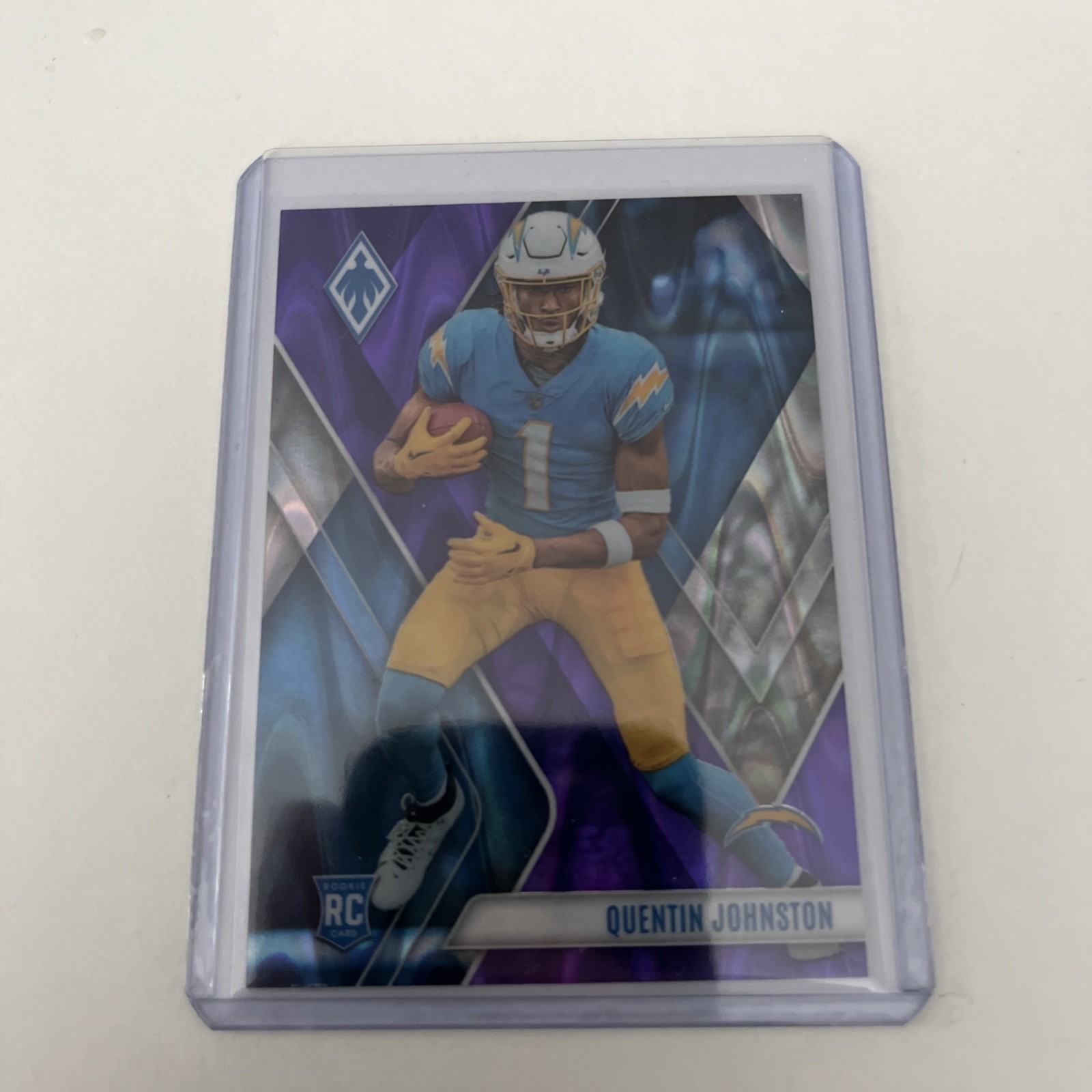 2023 Panini Phoenix Purple /125 QUENTIN JOHNSTON RC #107. Chargers