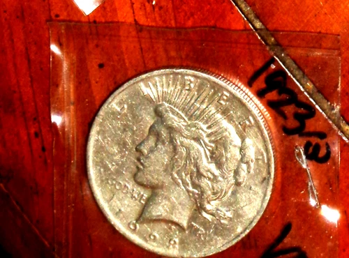 1923 SILVER PEACE DOLLAR - GRADES "VERY FINE"