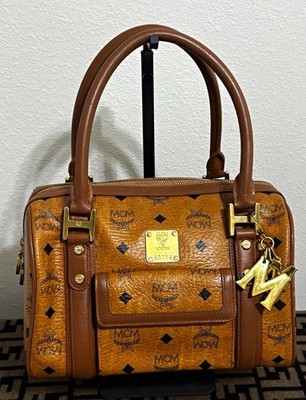 MCM Vintage Cognac Visetos Boston bag featuring a prominent gold logo plate