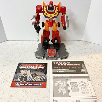 Hasbro Transformers Titanium Rodimus Prime Die-Cast Figure w/ Gun Stand