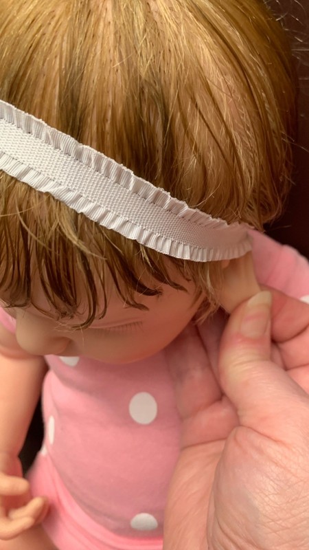 Hello. She is around 20 inch , around 7.6 lb , silicone full body doll