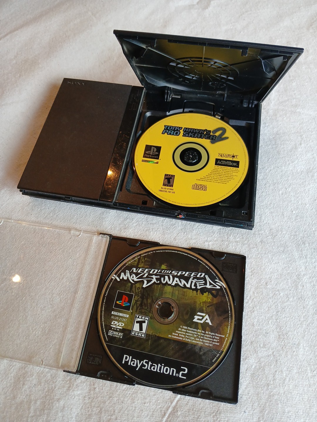 PS2 Slim Console with Need For Speed Most Wanted and Tony Hawk Pro Skater 2 Untested