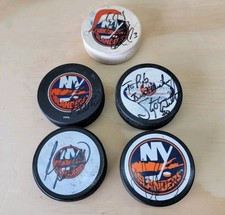 Lot of 5 Signed NY Islanders Hockey Pucks Circa 2000 Cairns/Chara/Webb + others