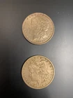 Lot of 2 Morgan silver dollars: 1879 O, 1886 Fine