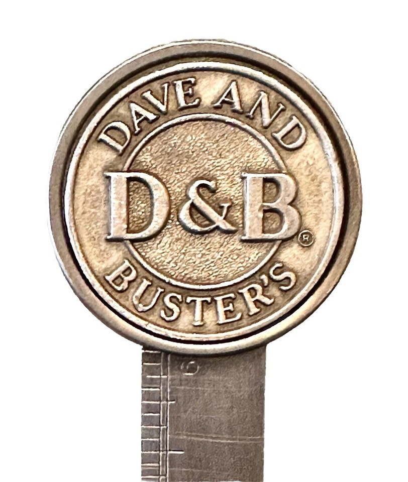 A pewter Dave & Buster's branded combo ruler and letter opener — bizarre corporate artifact that's more intriguing novelty than boring promo swag.