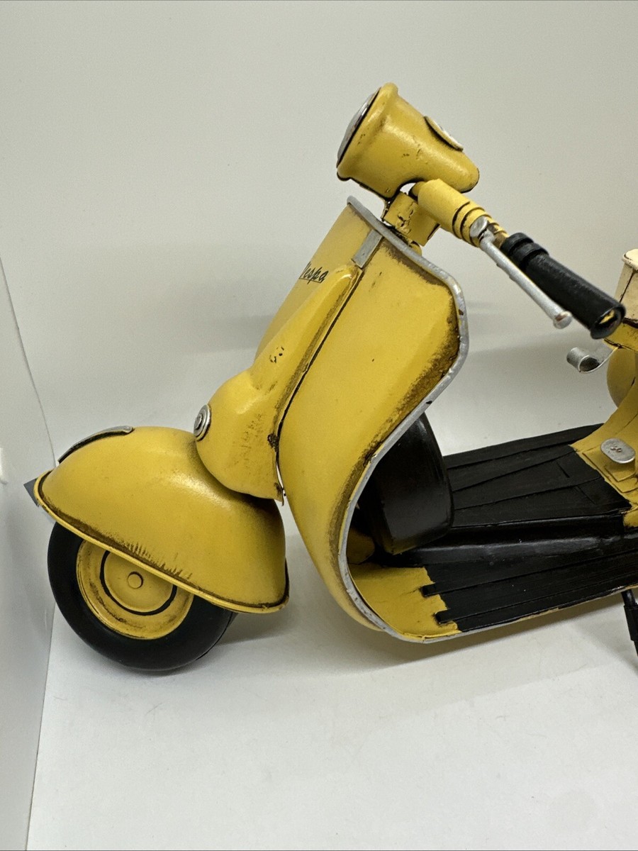 Tin Metal Art Sculpture of a Yellow Vespa Motor Scooter Stationary