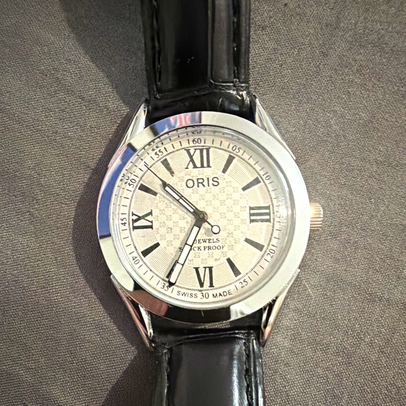 Oris Men’s Swiss Made Quartz Dress Watch Silver Roman Dial Black Leather