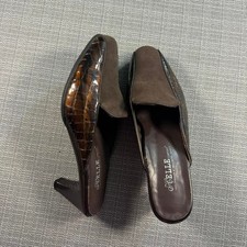 Helle Brown heeled mules with crocodile print.