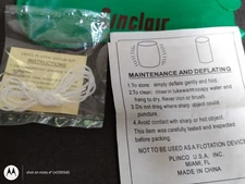 Green plastic Sinclair blow up dinosaur