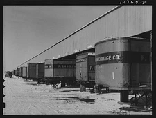Chicago, Illinois. Truck trailers line up at a freight house to load and unload