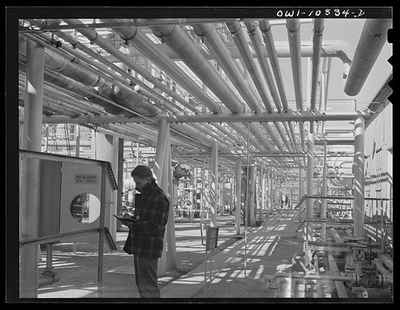 #ad Photo:Gasoline plant employee checking a meter $12.99