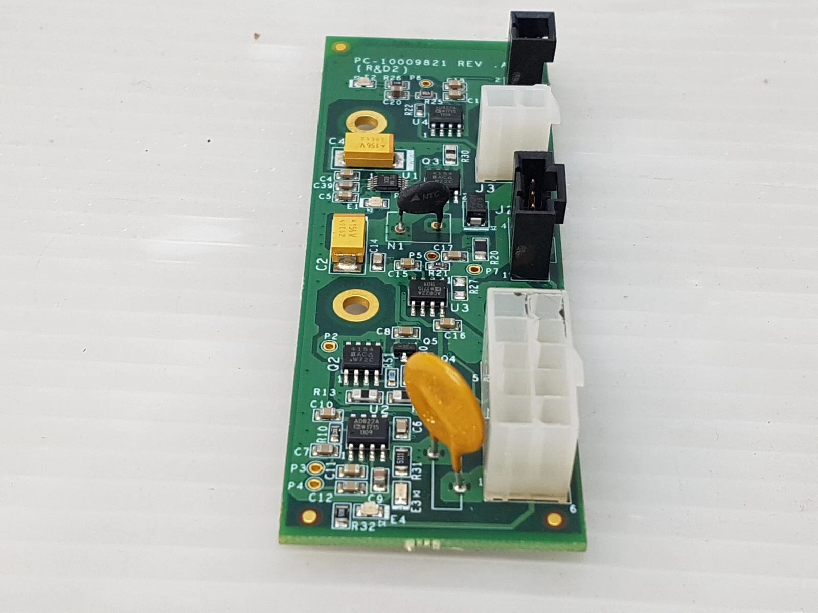 Lumenis PC-10009821 board photographed lengthwise, connectors along the right edge
