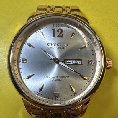 KINGNUOS K-189 Quartz Analog Wristwatch Silver Sunburst Dial Gold Bracelet Date