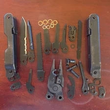 Parts from a Black Leatherman Super Tool 300 EOD: 1 Part for repairs or mods