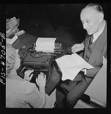Photo:1940s Man Woman Typing at Typewriter Office Meeting thumbnail