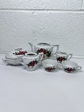 vintage Japanese child's tea set, featuring a red floral pattern with gold trim