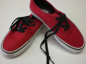 red and black low top vans