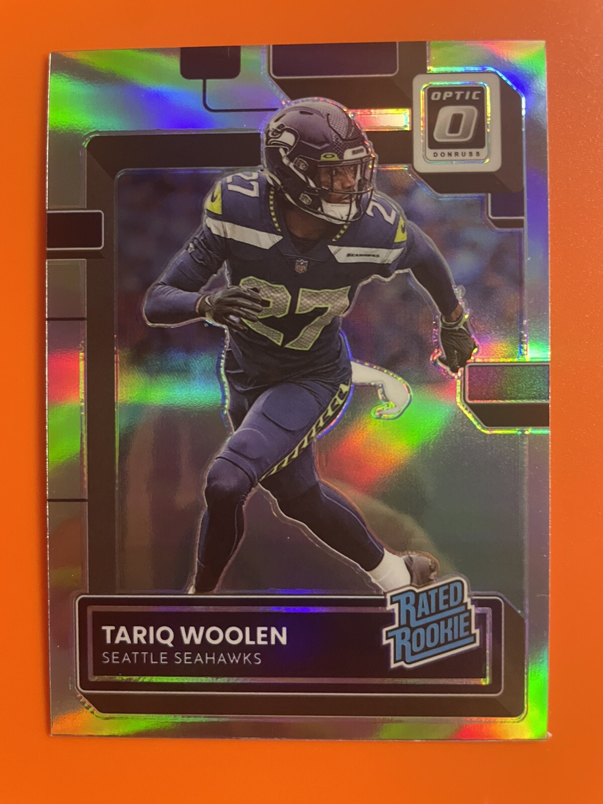 2022 Panini Optic Tariq Woolen RC #298 Silver Holo Prizm Rated Rookie Seahawks