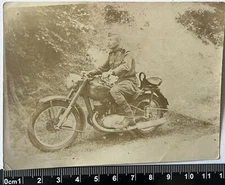 young guys on a motorcycle with a cigarette, soldiers in uniform, old photo