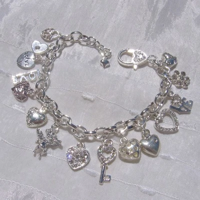 BRACELET ARGENTÉ 16 BRELOQUES coeurs ange fleur love - L'amour dans l'air - Photo 1/4