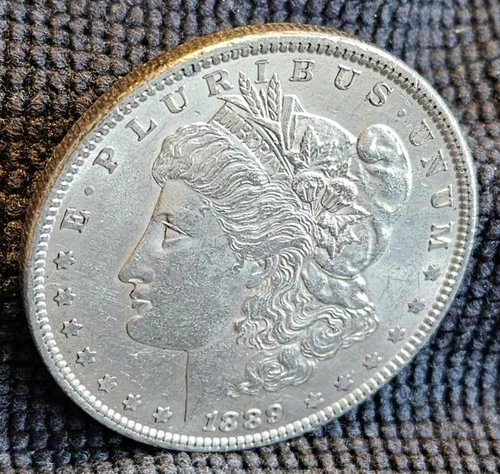 1889 Morgan Silver Dollar- .90 Silver- old light cleaning- EF Condition
