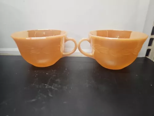 2- Vintage Fire King Oven Ware Coffee Tea Cups Peach Lustre Wheat Laural Leaves