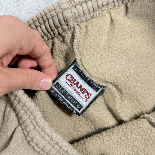 Tan khaki Russell Athletic Champs men’s XL sweatpants with elastic cuffs, front pockets, and visible “ATHLETIC Sports” tag.