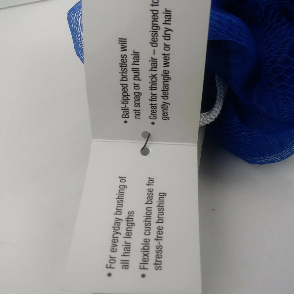 Cepillo exfoliante con paleta estilo desenredante resultados de salón profesional Conair Foto 4 de 4