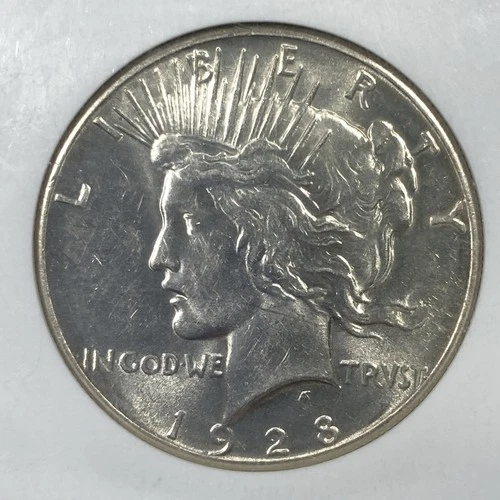 1928 Peace Silver Dollar 1.00. NGC AU58.